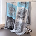 Detail of paisley print silk scarf with geometric patchwork hanging next to a handbag - Blue Patchwork Paisley Style (XD47-3) / Blue