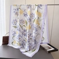 Detail of silk satin scarf featuring elegant purple tulip floral patterns and soft fabric - Blue