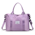 Purple nylon travel duffel bag with water-resistant fabric and adjustable shoulder strap - Purple