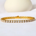 Close-up of gold plated tennis bracelet with sparkling zircon stones and safety clasp - 3mm*17cm / Gold
