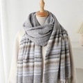 Detail of blue and beige woven scarf with V-pattern texture and tassel fringe - Blue