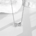Silver-toned bow pendant necklace featuring zircon micro-pave on a fine link chain - Full Zirconia Bow Style-Steel (N0059S)