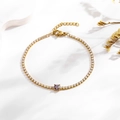 Detail of gold tennis bracelet with white zircon and purple square gemstone - Purple