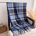 Close-up of blue and beige plaid scarf with fringe on a white armchair with reeds - 200x62cm / Blue
