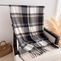 Macro detail of soft cashmere-like fabric with classic black and white plaid and tassels - 200x62cm / Black & White