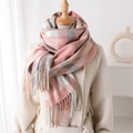 Detail of pink and grey plaid scarf texture with tassels on a mannequin in beige coat - 200x62cm / Pink