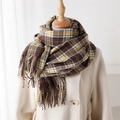 Detailed close-up of plaid cashmere-like scarf fringe and thick knit pattern in warm tones - Bright Yellow