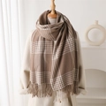 Classic earth-tone plaid scarf with long tassels draped on a beige coat for autumn winter - Tan