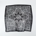Detail view of monochrome paisley pattern on a silky square satin scarf with black borders - 90x90cm / Black (FT264-4)