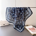 Dark blue floral cotton-linen feel square scarf with lace print draped on a metal bar - One Size / Navy Blue