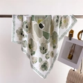 Detail shot of green floral silk square scarf with geometric borders draped on a metal bar - 70*70cm / FG17-2 Fresh Green Abstract Floral