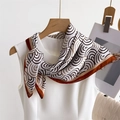 Detail of silk-like scarf with brown spiral patterns and red hem on a white dress - 66-70CM / Coffee Edge