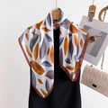 Elegant silk scarf with blue and orange leaf patterns hanging on a wooden hanger - 70*70cm / FG18-2 White Blue Orange Leaves