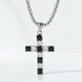 Macro shot of cross pendant with alternating black square gems and round cubic zirconia - Black and White Zirconia