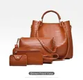 Detail of 4-piece brown crocodile embossed bag set with tote, crossbody, clutch and wallet - Dark Brown