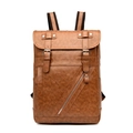 Close-up of vintage brown PU leather backpack with lychee texture and buckle flap detail - Brown