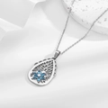 Silver hollow teardrop pendant with blue floral gemstone on a delicate link chain - Teardrop Hollow Blue Gem Flower (N0337)