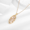 Golden oval hollow pendant necklace with three zircon stones on white marble base - Oval Hollow Three White Zircons (N0339G)