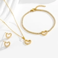 Golden heart jewelry set with zircon necklace bracelet and earrings on white background - Gold Necklace Bracelet Earrings Set