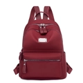 Women's minimalist burgundy oxford fabric backpack with stylish silver zipper detailing - Red