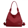 Deep wine red nylon tote bag with shoulder strap and brand leather tag detail - Burgundy