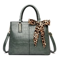 Dark green crocodile embossed handbag featuring a leopard print silk bow accessory - Green