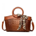 Brown crocodile texture handbag with round handle and leopard print scarf accent - Brown