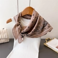 Detail of brown paisley silk scarf showing satin texture draped on white knitwear - One Size / Khaki (FR85-3)