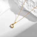 Exquisite gold heart pendant necklace with shimmering zircon accents on white stone - Hollow Zirconia Heart Necklace (N0058)