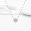 Detailed close-up of a silver pavé-set round pendant with micro-zirconia on a link chain - Full Zirconia Circle Style / Steel