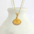 Macro detail of gold scallop shell pendant with crystals on a white ceramic vase - Gold Shell (N0407G)