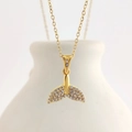 Close-up of a gold-plated fishtail pendant necklace with shimmering pavé crystal details - Gold Fish Tail (N0409G)