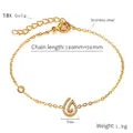 Macro detail of gold stainless steel bracelet with rhinestone drop pendant and dimensions - Teardrop / Gold