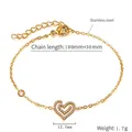 Detailed macro view of 18K gold plated stainless steel heart bracelet with sparkling zircon - Heart Shape / Gold