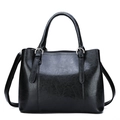 Classic black tote bag in glossy patent leather with top handles and silver hardware - Black
