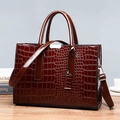 Deep reddish brown crocodile pattern handbag set with glossy finish and silver hardware - Brown