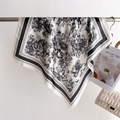 Detail of Toile de Jouy patterned silk scarf showing delicate forest and animal prints - Black