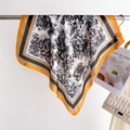 Detail of vintage landscape pattern on cream silk scarf with orange contrast border - Yellow