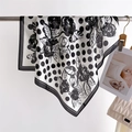 Polka dot and camellia print silk-like square scarf draped over a metal rod - White (FJ997-1)