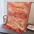 Detail of artistic silk scarf featuring desert camel caravans and golden mountains - 180*70cm / Orange Red