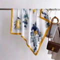 Detail of floral silk scarf showing elegant drape and vibrant patterns on a metal rod - White (FM305-3)