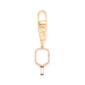 Golden enamel pickleball racket keychain with white pearls and luxury clasp closure - White and Black (KZ250101-0006)