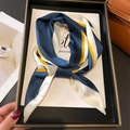 Elegant geometric striped silk scarf in navy blue and orange tied on a display tray - Navy Blue Stripe Style (LE1-1)