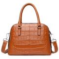 Brown crocodile pattern handbag with top handles and adjustable shoulder strap on white base - Chocolate