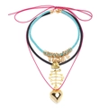 Layered bohemian necklace set featuring sea shells, fishbone pendant, and heart charms - Multi-color/Style A