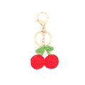 Handmade woven cherry pendant keychain with red fruit and green leaves on white background - Red Cherry Style