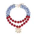 Layered beaded necklace with colorful beads and gold evil eye pendant on white backdrop - Mixed Red Blue and White
