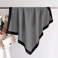 Detail of silk-like scarf with black and white V-pattern and elegant draped texture - 90x90cm / Black and White