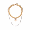 Bohemian layered necklace with wooden beads and a natural seashell pendant on white background - Multicolor