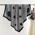 Detail of silk scarf with black and white houndstooth and camellia flower patterns - Black Border